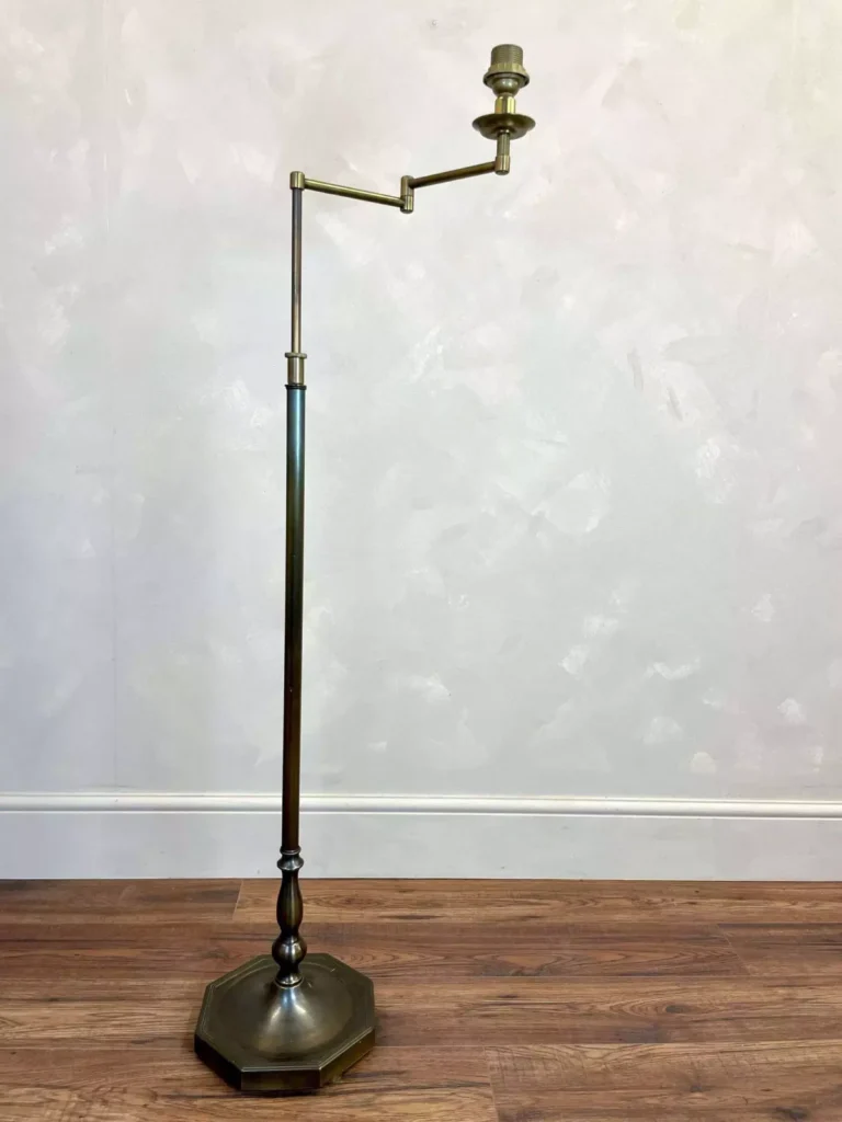 floor lamp casts a dark shadow on the page